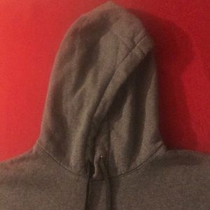 This is a solid grey nike hoodie.